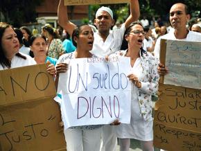 Striking nurses in Caracas demand a fair wage and relief from the crisis