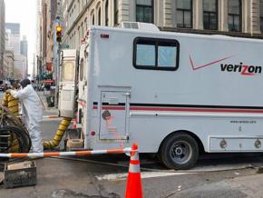 A Verizon worker repairs cables in lower Manhattan