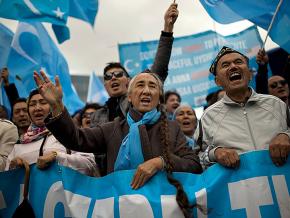Uyghur protesters demand justice during a demonstration in Brussels